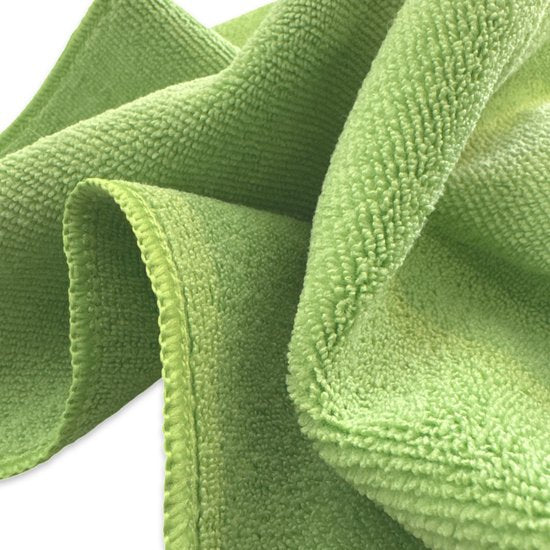 Close-up van de zachte structuur van de groene microvezeldoek